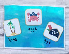 a card with pirate pictures on it and the word crab written in black ink next to an image of a palm tree