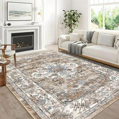 a living room filled with furniture and a rug on top of a hard wood floor