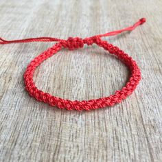 This list is for one anklet/bracelet. It is made of nylon twine. Designed for everyday wear. Water Resistant and Waterproof. It has an adjustable closure that will fit a 6.5"-7"regular fit wrist. It also opens to around 12.5" -13" inches to fit as anklet. Adjustable Braided Red Jewelry, Casual Red Friendship Bracelets With Adjustable Cord, Red Resizable Friendship Bracelets For Everyday, Casual Red Braided Bracelets, Handmade Red Braided Bracelets With Nylon Cord, Handmade Red Braided Nylon Cord Bracelets, Handmade Red Nylon Cord Braided Bracelets, Red Adjustable Nylon Cord Bracelets, Adjustable Red Braided Nylon Cord Bracelet