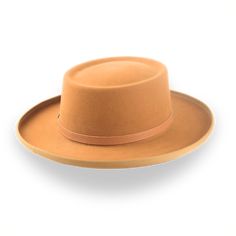 Description Materials Craftsmanship Hat Care Shipping Returns Product Description A Gambler Style Cowboy Hat for All Occasions Discover the perfect blend of style and comfort with the Ithaca, a gambler-style cowboy hat crafted from premium rabbit fur felt. This hat features a distinctive telescope crown and a 3 1/2" ribbon-bound rolled brim, ensuring a standout look that captures rugged elegance. The leather hat belt adds a touch of refinement, while the viscose satin lining and genuine leather Cowboy Hat Crafts, Homburg, Chapeau Cowboy, Leather Hat, Cowboy Style, Hat Box, Leather Hats, Formal Casual, Cow Boy