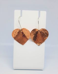 Hammered Texture Effect Domed Copper Heart and Sterling Silver Earrings I love having a good selection of earrings, that you can just throw on, and they look good with anything.  These earrings are exactly that! These lovely copper hearts have been hammered to add texture, then domed and added to lovely round shaped sterling silver earwires. Simple, but effective! Will be supplied on an earring card, with a free care card. Heart Shaped Metal Earrings For Valentine's Day, Heart-shaped Metal Earrings For Valentine's Day, Heart-shaped Silver Copper Jewelry, Silver Heart-shaped Copper Jewelry, Rose Gold Metal Heart Earrings For Valentine's Day, Nickel-free Heart-shaped Rose Gold Earrings, Rose Gold Pierced Heart Drop Earrings, Handmade Metal Earrings For Valentine's Day, Heart-shaped Nickel-free Earrings For Anniversary