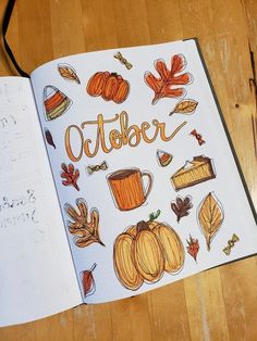 an open notebook with the words october written in orange and brown on top of it