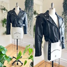 ♡ PLEASE ENLARGE PHOTOS FOR MORE DETAIL ♡ D E T A I L S * 1980s/1990s jacket  * genuine black leather * snap-down epaulettes on shoulders * snap-down lapel collar * long sleeves with functional zippers at wrists * two zippered pockets + one snap-closure pocket on front, two inner pockets * cropped length - perfect to wear with full skirts! * adjustable buckled belt attached at side seams * sturdy metal zipper closure up front * lined in black nylon * label: M.G.R. M E A S U R E M E N T S fits like a: large shoulders: 19" bust: 41" waist: 35" (cinches down to 33" with belt on smallest setting) length: 18" sleeve length: 22" sleeve width: 16.5" (at underarm) C O N D I T I O N Excellent vintage condition. No issues to note and ready to wear! Retro Single-breasted Leather Jacket With Long Sleeves, Vintage Black Leather Jacket With Front Zip, 80s Cropped Leather Jacket, Black Vintage Leather Jacket With Button Closure, Vintage Distressed Leather Outerwear, Punk Jacket, Label M, Full Skirts, Leather Moto