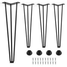 four black metal poles with screws and nails on them, all in different sizes