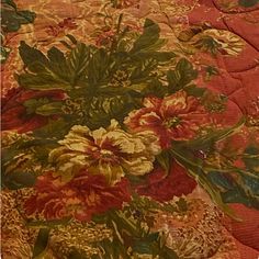 an image of a bed with flowers on the bedspread and comforter cover