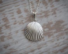 Seashell Pendant Necklace in Sterling Silver, silver seashell, sea creatures, beach jewellery Gorgeous sea pendant works well on both a long chain and short, this is an incredibly eye-catching piece. Beautiful gift for someone special whether that's a best Friend, sister, girlfriend, wife or mother. Or you.  Chain length in photo: 45cm / 17.7inch Seashell: 2.5cm / 1.0inch x 2.0cm / 0.78inch Check out the rest of our range: https://www.etsy.com/uk/shop/IvyStoneCreative Shell-shaped Sterling Silver Jewelry For Beach, Silver Shell-shaped Ocean-inspired Jewelry, Silver Shell For Beach With Ocean-inspired Style, Elegant Silver Strand Jewelry, Silver Shell Jewelry For Beach, Silver Strand Shell Necklace For Beach, Ocean-inspired Silver Shell Necklace, Silver Shell Necklace For Gift, Silver Shell Gift