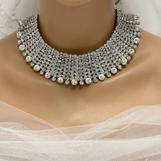 Indian Wedding Jewelry Set, Bridal Choker Necklace Earrings, Elegant Silver Kundan Bridal Set, Bollywood Fashion Jewelry, Perfect Wedding Gift, Bridal Choker Necklace Earring Set, Silver Kundan Indian Wedding Jewelry, Bollywood Bridal Jewelry, Stunning Wedding Gift, Silver Kundan Bridal Indian Jewelry Set, Elegant Choker Necklace Earrings, Bollywood Fashion Jewelry, Ideal Wedding Gift Enhance your bridal ensemble with our exquisite Indian Wedding Jewelry Set, an essential addition to any bride's White Metal Jewelry Sets For Wedding, White Metal Wedding Jewelry Sets, Rhinestone Metal Jewelry Sets For Weddings, Bling Jewelry Sets For Wedding, Wedding Rhinestone Metal Jewelry Sets, Wedding Jewelry With Bling And Round Shape, Round Sparkling Jewelry For Wedding, Silver Pearl Wedding Jewelry Sets, Dazzling Bling Wedding Jewelry