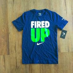 Nike Fired Up Tee Shirt Size Youth M. Nwt Sports Shirt With Blue Logo Print, Nike Navy T-shirt With Graphic Print, Blue Sports Shirt With Graphic Print, Blue Graphic Print Sports Shirt, Nike Navy Tops With Letter Print, Nike Blue Shirt With Graphic Print, Blue Graphic Tee For Sports, Sporty Blue Shirt With Screen Print, Nike Blue Graphic Tee