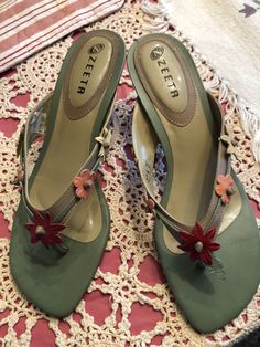 Well made leather and wood sandal. Leather flowers on strap. Excellent condition. No scuffs .original price was 125.00 . Made in Brazil.Seafoam green with orange yellow and rust flowers. Vintageleather Sandals 1970, Green Heels With Wooden Heel For Summer, Green Sandals With Wooden Heel For Summer, Green Closed Toe Sandals With Wooden Heel, Green Heels With Wooden Heel For Spring, Spring Green Heels With Wooden Heel, Green High Heel Sandals With Wooden Heel, Green Sandals With Wooden High Heel, Green Open Toe Vintage Sandals