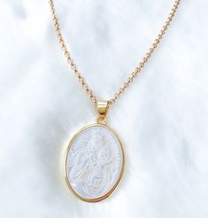 "Mother of pearl Our lady of Mount Carmel  necklace  If you're a catholic person, I'm sure you will like this dainty mother of pearl carved medal with 18k gold filled chain. It's a necklace you can wear everyday. Simple, classic and elegant.  MATERIAL AND SIZE Mother of pearl medal Medal size: 2cmx1.5cm Length: 16\", 18\" or 20\" Our lady of Mount Carmel If you have questions about the product, feel free to reach me out. Don't forget to check out my other items in the store: Https://www.etsy.com Scapular Necklace, Miraculous Medal Necklace, Mary Necklace, Virgin Mary Necklace, Mount Carmel, Catholic Jewelry, Catholic Gifts, Agate Necklace, Mother Mary