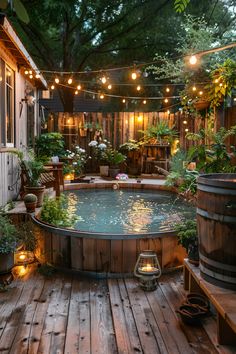 an outdoor hot tub surrounded by potted plants and string lights hanging from the ceiling