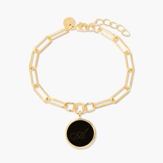 Bold and beautiful, this personalized enamel initial charm bracelet makes a statement with any outfit. Available in three stunning colors, the enamel is personalized with your or a special someone’s initial. The charm hangs elegantly from a modern, elongated link chain. Give as a gift or treat yourself! Available in 14k gold plated brass Enamel filled pendant measures 5/8" 6" elongated link chain with 1" extender Lobster claw closure With engraving this item is FINAL SALE SKU: BYB1106 Elegant Charm Bracelet With Logo Charm As Gift, Elegant Black Monogram Jewelry, Initials Charm Bracelet Gift, Elegant Personalized Paperclip Bracelet For Everyday, Elegant Initials Charm Bracelet Gift, Trendy Monogram Jewelry For Personalized Gifts, Elegant Initials Chain Bracelet, Trendy Monogrammed Jewelry For Personalized Gifts, Elegant Personalized Enamel Jewelry