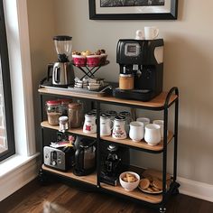 a coffee bar with cups and other items on it