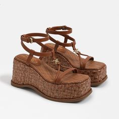 A chunky basketweave wedge with cool curves plays perfectly against dainty ankle-wrap straps and logo charm detail. Be sure to try with a wide flare to give off some vintage vibes.. Heel Height: 3.3 inches. Platform Height: 1.7 inches. Toe: Square. Closure: Buckle. Material: Leather. Insole: Synthetic.  . Shoes Trendy, Funky Shoes, Fresh Shoes, Womens Summer Shoes, Aesthetic Shoes, Swag Shoes, Pretty Shoes, Dream Shoes, Dress Sandals