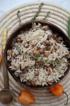 a bowl filled with rice and beans on top of a table