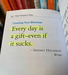 an open book with the words every day is a gift - even if it sucks