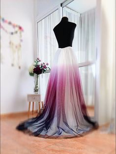 This gorgeous skirt is ideal for your special events like balls, photoshoots and as a bridal skirt.  It is made of a beautiful 3 colour gradient soft tulle, pleated at the waist and wide at the bottom (A line).  It also has another layer of ivory soft tulle and lining.  It can be made floor length or with a 50cm train, like the one in the pictures.  It closes with an invisible zipper at the back. The waistband is made of satin.  We can make alterations to the design if wanted.  This skirt is made to your measurements so please enter them at checkout.  For more items like this please visit my Etsy shop: www.SindyBloom.etsy.com Prom Tulle Long Skirt Bottoms, Pink Full Skirt Bottoms For Wedding, Pink Pleated Wedding Skirt, Long Tulle Bridesmaid Skirt, Pink Lined Maxi Skirt For Wedding, Tulle Flared Skirts For Wedding, Elegant Tulle Skirt With Long Train, Tulle Flared Wedding Skirt, Long Tulle Skirt For Wedding