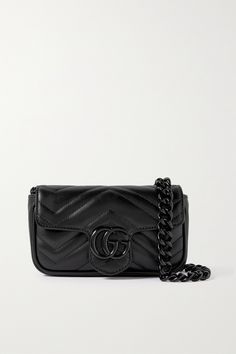 This 2.0 version of Gucci's 'GG Marmont' bag can be worn a variety of ways - simply carry it cross-body or adjust the hook-fastening strap to style it around your waist. It's been made in Italy from supple quilted black leather and opens to a compact interior that'll hold the essentials - think your phone, cardholder and lipstick. All Black Gucci Bag, Gucci Black Purse, Gucci Crossbody Shoulder Bag With Removable Pouch, Gucci Crossbody Shoulder Bag For Everyday Use, Gucci Luxury Shoulder Bag With Gunmetal Hardware, Gucci Soft Leather Shoulder Bag, Luxury Gucci Shoulder Bag With Gunmetal Hardware, Gucci Soft Leather Rectangular Shoulder Bag, Gucci Leather Belt Bag With Removable Pouch