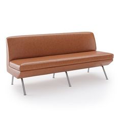 a brown leather couch sitting on top of metal legs