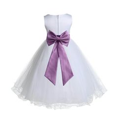 The elegant upper bodice feature is made out of White Satin Poly. The waistline is decorated with a removable Choice of Color tie bow sash and flower to make this dress more elegant. The skirt has 4 layers (SEWN TOGETHER), top 1st and 2nd layers is made of elegant tulle with a rattail edge. 3rd layer is a attached crinoline netting for additional fullness and the 4th layer is another layer of soft satin lining to bring comfort to your little girl while wearing the dress. The back of the dress ha Sleeveless Flower Girl Dresses, White Wisteria, Bow Sash, Formal Evening Gown, Tulle Flower Girl, White Flower Girl Dresses, Satin Tulle, Wedding Flower Girl Dresses, Prom Ball Gown