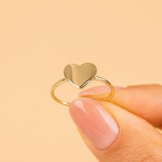 A sign for your heart, our solid 14k gold ring is ready to show what your heart can't. Adding a personal touch to this ring with an engraving is essential. We can Engrave almost anything - Initials, Zodiac signs, Hearts, Stars, you name it! - Handmade - Solid Gold - Dimensions of the Heart: 8.65 x 9.7 mm - Size of the Band: 1.2 mm 🛠 Your Sarah Elise piece is handcrafted with care! Ready-to-ship items go out within 3 business days. Made-to-order pieces typically take 7-10 business days to create 14k Gold Heart Ring With Polished Finish For Wedding, Minimalist Heart Promise Ring With Polished Finish, Minimalist Heart Shaped Signet Ring For Promise, Minimalist Polished Heart Ring For Anniversary, Heart Shaped Promise Rings Stamped 14k, Heart-shaped 14k Promise Ring, Minimalist Heart Shaped Signet Promise Ring, Valentine's Day Sterling Silver Signet Promise Ring, Heart-shaped Promise Ring With Polished Finish