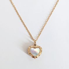 LOVE SHELL NECKLACE: ✦ Small convex heart necklace engraved on both sides and set with white mother of pearl  COMPOSITION: ✦ Gold plated 18K stainless steel ✦ White mother of pearl SIZE: ✦ Pendant: 1.2 x 1.2 cm ✦ Chain lenght: 40 cm + 5 cm extension JEWELLRY CARE: ✦ This jewel is made of stainless steel which makes it tarnish resistant and waterproof. Over time, the golden layer can acquire a slight patina.  In order to keep your jewel as the first day, it is recommended to remove it regularly f Rose Gold Stainless Steel Heart Pendant Jewelry, White Stainless Steel Necklaces For Anniversary, White Stainless Steel Necklace For Anniversary, Rose Gold Heart Charm Necklace In Stainless Steel, Mother Of Pearl Heart Pendant Jewelry Gift, Rose Gold Heart Pendant Necklace In Stainless Steel, Rose Gold Heart Necklace In Stainless Steel, Dainty Stainless Steel Necklaces For Valentine's Day, White Stainless Steel Necklaces For Mother's Day