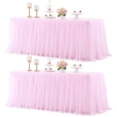 two tables covered in pink tulle with candles