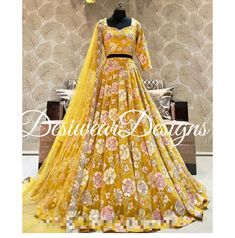 Made to Order/Measurement/Custom Order Lehenga - Color : Yellow - Fabric : Embroidered Georgette  - Fully flared paneled lehenga -   Attached  Dupatta with Blouse - Drawstring closure with Tassels - - It can be customize in any design or size  PLEASE NOTE: BUYERS ARE RESPONSIBLE FOR ANY CUSTOMS AND IMPORT TAXES THAT MAY APPLY. This is a made to order product. If you opt for 'Made To Measurement Option', we will provide a measurement template and you can share the measurements likewise. If you want to opt for 'Standard Size', Please refer to the size chart provided in the listing. Shipping: Standard Shipping is done by DHL ecommerce and it mostly takes 2 to 3 weeks to deliver after dispatch. Express Shipping is done by DHL express and it mostly delivers within a week after dispatch. Fabric Designer Yellow Lehenga With Floral Embroidery, Yellow Choli With Floral Embroidery For Reception, Yellow Floral Embroidered Sharara For Reception, Reception Yellow Floral Embroidered Sharara, Yellow Floral Embroidery Sharara For Reception, Wedding Gold Sharara With Floral Embroidery, Designer Yellow Choli With Floral Embroidery, Reception Yellow Sharara With Intricate Embroidery, Yellow Lehenga With Floral Embroidery For Festive Occasions