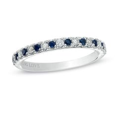 a white gold ring with blue and white diamonds