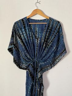 Hand Tie Dye Kaftan Crepe Silk Kaftan Summer Silk Kaftan Bohemian Kaftan Long Silk Tie Dye Kaftan Comfy Bridesmaid Kaftan Hand Dyed Kaftan Hand Tie Dye Kimono Robe, Pure Silk Robe, Summer Silk Kimono Robe, Bohemian Kimono Robe, Long Silk Tie Dye Kimono, Comfy Bridesmaid Kimono WELCOME TO MY SHOP   100% SILK TIE DYE FABRIC , ULTRA LIGHT WEIGHT. This Kaftan IS MADE TO BE WORN for Night Wear, Lounge Wear, Loose Fit Resort Dress. Product Detail :- Handmade Item Item Name :- Crepe Silk Silk Long Kaftan Material :- Crepe Silk Bust/chest size -  52″ Inches Length - 50″ Inches Perfect for lounge, resort, vacation, swimsuit cover up on the beach or by the pool, with shorts and a tank top or over a summer dress. NOTE : Product color may slightly vary due to photographic lighting sources or your moni Indigo Bohemian Kimono For Summer, Bohemian Indigo Kimono For Summer, Summer Bohemian Indigo Kimono, Bohemian Multicolor Kaftan With Back Tassel Tie-up, Blue Batik Print Beach Kimono, Beach Blue Batik Print Kimono, Blue Bohemian Tunic In Free Size, Free Size Blue Bohemian Tunic, Blue Bohemian Tunic, One Size Fits All