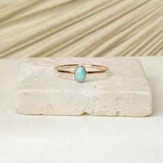 Turquoise Stone has often been associated with protection, luck, and abundance. In many cultures , it is believed that wearing turquoise can ward off negative energies and bring good fortune. Details: 14K Gold Filled + Sterling Silver 6x4mm Turquoise 1.3MM Textured Ring Since every piece is handmade, you may experience a slight color difference in places where the metal has been soldered making every piece truly unique. Purchase three or more rings and save 20% with discount code 'STACK20' 14k Gold Turquoise Oval Cabochon Ring Gift, Oval Turquoise Stackable Ring As Gift, Turquoise Opal Ring In 14k Gold As Gift, Oval Stackable Turquoise Ring As Gift, Oval Stackable Turquoise Ring Gift, Oval Turquoise Birthstone Ring, Minimalist Turquoise Oval Ring, Textured Ring, Oval Ring