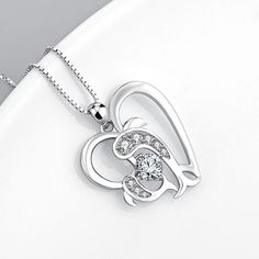 SKU#:JU075NLNecklaceInformationMetal: 925 Sterling SilverStone Color:WhiteStone Type:SapphireChain Length: 40cm+0.8mmPendant Size: 24.9*21.5mmWeight: 5.22gPlating Color: SilverTheme: Animal*Customized service of this item is available. please contact our customer service to place orders. Please notice that: the change of the stone color and plating color is available while the material of gemstones and metal cannot be accepted.*All stone weights (CT.) are approximate and listed as diamond equiva Silver Birthstone Necklace For Anniversary With Clavicle Chain, White Gold Cubic Zirconia Jewelry As Gift For Mom, White Gold Cubic Zirconia Jewelry For Mom, Diamond White Pendant Necklace As Gift For Her, Elegant Necklace With Diamond Accents For Mom, Elegant White Gold Birthstone Necklace For Mother's Day, Silver Heart Cut Birthstone Necklace, Gift White Gold Birthstone Necklace With Cubic Zirconia, Gift White Gold Cubic Zirconia Necklace