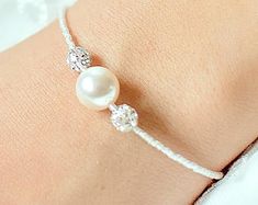 Bridal bracelet Lea Pearl bridal bracelet bridal jewelry | Etsy Round Pearl Beaded Bracelets For Wedding, Adjustable Beaded Bracelets With Pearl Drop For Bridesmaid, Pearl Beaded Bracelets For Wedding, Adjustable Pearl Embellished Bracelet, Adjustable Pearl Embellished Bracelet For Wedding, Adjustable Pearl Drop Bracelet For Bridesmaids, Pearl Beaded Bracelets With Pearl Charm For Wedding, Beaded Pearl Bracelet For Anniversary, Elegant Adjustable Pearl Bracelet With Faceted Beads