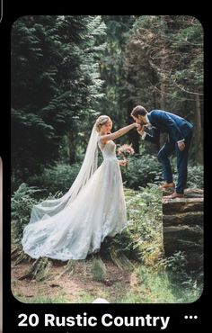 a man and woman standing next to each other on top of a tree stump in the woods