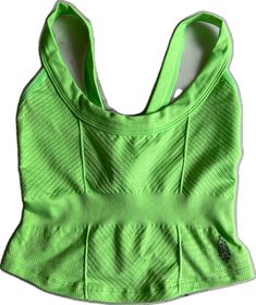 Casual Green Sports Bra With Built-in Bra, Green Fitted Sleeveless Sports Bra, Sporty Green Tops With Built-in Bra, Spring Green Racerback Activewear, Green Seamless Sportswear Tops, Green Fitted Racerback Activewear, Green Stretch Sleeveless Sports Bra, Spring Seamless Green Sports Bra, Green Casual Sports Bra With Medium Support