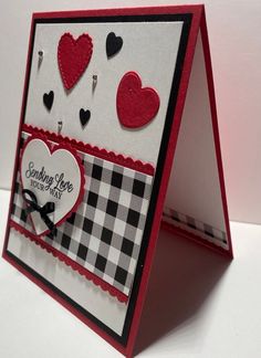 a close up of a greeting card with hearts on the front and back of it