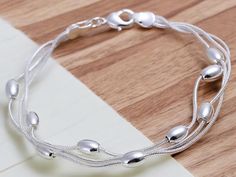 ��✨ Add elegance to your style with our 925 Sterling Silver Bracelet! This stunning piece of fine jewelery has a stylish design that exudes sophistication. This bracelet made of high quality pure silver and delicate beads. Whether for daily use or on special occasions, reward yourself or someone special with this luxury accessory! 💎💖 Pure Silver Bracelet For Women, Silver Bracelet For Women, Silver Bracelets For Women, Bracelet Fashion, Fine Jewelery, Bracelet Argent, Luxury Accessories, Bracelet For Women, Sterling Silver Bracelet