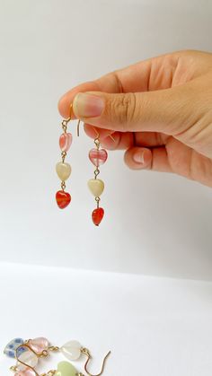 These cute stone hearts are sure to add a fun flare to your style. Adjustable Heart Beads Dangle Earrings, Handmade Heart-shaped Trendy Earrings, Trendy Dangle Earrings With Heart Beads, Trendy Adjustable Heart-shaped Earrings, Adjustable Heart-shaped Earrings, Trendy Heart Beaded Earrings For Valentine's Day, Adjustable Trendy Heart Earrings, Stone Heart, Heart Earrings