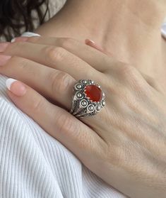 This exquisite embroidery ring is handcrafted and oxidized with the highest quality materials. The 925 sterling silver band is filigree art designed and oxidized for an antique look. The Carnelian gemstone is a 10x12 mm cabochon oval cut, set in a bezel setting. The ring face length is 0.9 inches / 22.50 mm and width is 0.80 inches / 20.00 mm. It comes with a velvet pouch, silver polish cloth and a luxurious gift box, making it the perfect option for any occasion - Mother's Day gift, thanksgivin Oxidized Finish Filigree Ring For Gift, Ornate Carved Filigree Ring As A Gift, Ornate Carved Filigree Ring For Gifts, Ornate Carved Filigree Ring As Gift, Ornate Carved Filigree Ring Gift, Bohemian Filigree Ring With Oxidized Finish As Gift, Filigree Rings, Embroidery Ring, The Ring Face