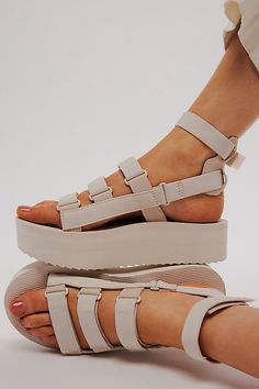 Reach new heights in these upgraded Teva gladiator-style sandals featuring an elevated flatform sole and organic cotton straps with multiple points of adjustability for your perfect fit. * Hook-and-loop closures for adjustable fit * Rubber sawtooth outsole * Molded EVA midsole * Removable ankle strap | Teva Flatform Mevia Sandals at Free People in White, Size: US 10 Flatform Sandals Outfit, Teva Flatform Sandals, Teva Sandals Outfit, Platform Sandals Outfit, Teva Flatform, Teva Sandals, Shoes Outfit Fashion, Europe Outfits, Sandals Outfit