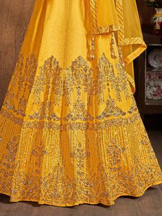 Look absolutely stunning on your special day with this exquisite yellow zari embroidery art silk bridal lehenga choli with dupatta. Made from high-quality art silk material, this yellow lehenga features intricate zari work, sequin work, embroidery work, and diamond work, making it a true masterpiece.
The lehenga comes in a beautiful yellow color, representing joy and vibrancy. It is semi-stitched up to 42 inches, allowing you to customize it according to your specific measurements. The accompany Fitted Yellow Art Silk Embroidered Fabric, Fitted Yellow Embroidered Art Silk Fabric, Yellow Semi-stitched Salwar Kameez With Intricate Embroidery, Unstitched Yellow Salwar Kameez With Intricate Embroidery, Semi-stitched Yellow Salwar Kameez With Intricate Embroidery, Yellow Floor-length Salwar Kameez With Intricate Embroidery, Floor-length Yellow Salwar Kameez With Intricate Embroidery, Reception Yellow Sharara With Intricate Embroidery, Yellow Salwar Kameez With Intricate Embroidery For Diwali