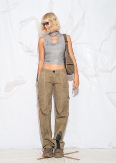 These Y2K vintage trousers are like a cargo party for your legs, hand-painted and low-rise for all your early 2000s shenanigans! Features: - overdyed mud wash brown colour - six pockets - zip closure - 100% cotton - reworked Every item we manage is cleaned and, when necessary, repaired, ensuring it arrives to you in top condition. Our model, Kitti is 170 cm / 66.3" tall and she's a size XS. Size: S / US 4 / UK 8 / IT 40 Other size info: Labelled size: 34 Measurements:  waist (seam to seam): 40 c Grunge Cargo Pants With Pockets For Spring, Y2k Style Straight Leg Cargo Parachute Pants, Y2k Cargo Style Straight Leg Parachute Pants, Y2k Straight Leg Parachute Cargo Pants, Y2k Style Cargo Jeans For Summer, Y2k Cargo Jeans For Summer, 90s Wide Leg Parachute Pants With Cargo Pockets, 90s Style Summer Pants With Cargo Pockets, 90s Cargo Style Pants For Streetwear