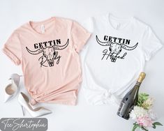 two t - shirts that say, gettin'and the other one has a cow on it