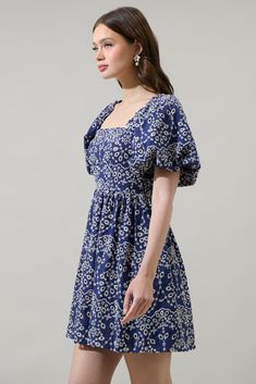 Sweetness meets sophistication in our charming eyelet mini dress featuring a square neckline framed by billowing bubble sleeves. Princess seams add shape to a fitted bodice with a smocked back, topping a flared skirt. Wear it with any heels of your choice. - Eyelet- Babydoll- Tucked bubble sleeve- Smocked back- Color: Navy WhiteSize + Fit - Model is 5'8" and wearing size XS- Measurements taken from size S - Chest: 16"- Length: 27 1/2" Fabric Self: 100% Cotton, Lining: 97% Polyester 3% Spandex St Bubble Sleeve, Princess Seams, Princess Seam, Square Necklines, Flared Skirt, Babydoll Dress, Fitted Bodice, Flare Skirt, Square Neckline