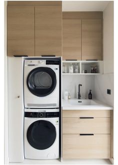 the washer and dryer are separated from each other in this small kitchen area