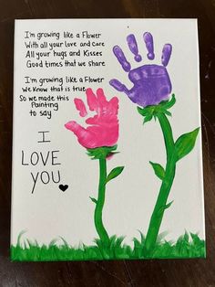 a card with two handprints on it and the words i love you written in purple