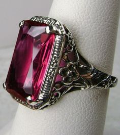 Excited to share the latest addition to my #etsy shop: 5ct Simulated Cushion Cut Ruby Sterling Silver Floral Nouveau Filigree Ring {Made To Order} https://etsy.me/31AkkMD #jewelry #ring #sterling #silver #girls #red #ruby #girlboss #fortworth #dallas Antique Ruby Ring Hallmarked, Vintage Hallmarked Ruby Ring For Formal Occasions, Heirloom Emerald Cut Ring With Intricate Design, Intricate Ruby Wedding Ring, Antique Emerald Cut Rings For Gift, Classic Filigree Ring With 17 Jewels For Wedding, Antique Emerald Cut Rings With Intricate Design, Antique Emerald-cut Rings For Gifts, Vintage Rectangular Ruby Ring For Formal Occasions