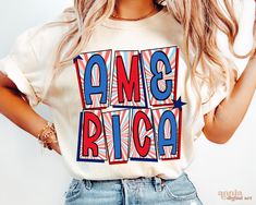 a woman wearing an american flag t - shirt with the words ame rica on it