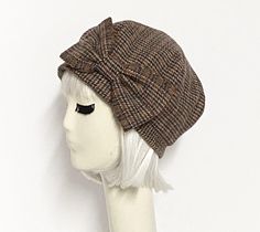 That Girl Beret hat multi color wool tweed, lined in printed rayon blend, the top of the hat is made up of 6 section crown, wool bias 1" fitted band and has a elastic band inside. One size fits most up to a 22" head size Made in the USA Dry clean only Brown Retro Beret For Fall, Retro Brown Beret For Fall, Fitted Wool Cap, Fitted Felt Cap For Fall, Retro Fitted Cloche Hat With Short Brim, Fitted Fall Felt Cap, Fitted Wool Cloche Hat For Fall, Classic Fitted Beret With Short Brim, Fitted Wool Flat Cap