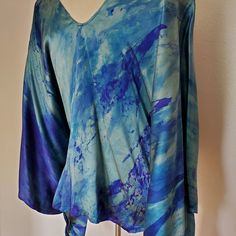 New Hand Painted Silk Caftan. One Of A Kind And Versatile For Casual Or Formal Occasions. This Will Fit Multiple Sizes. You Can Alter The Side Seam To Make It More Fitted If Desired. Easy Care, Machine Wash On Delicate, Cold Water Gentle Detergent Or Shampoo And Hang Dry. Camilla Style Beach Caftan Kaftan Top Coverup Travel Beach Resort Wear Runway Summer Holiday. Tie Dyed Green Blue Purple Navy Aqua Indigo Powder Blue Bohemian Designer Beach Party Or Lounge Wear Travel Boho Jetset Gypset Holida Blue Relaxed Fit V-neck Tunic, Blue Relaxed Fit Tunic Blouse, Blue Bohemian Top With Kimono Sleeves, Blue Tunic With Kimono Sleeves For Summer, Blue Silk V-neck Blouse, Blue Tunic With Kimono Sleeves, Blue Tunic With Kimono Sleeves For Spring, Blue Bohemian Relaxed Fit Blouse, Hand-dyed Blue Tops For Spring